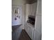 Pantry with all-white cabinets and silver hardware, providing ample storage space at 2411 Quail Ct, Bradenton, FL 34209
