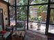 Screened-in patio offering serene views of the tropical backyard and lush greenery at 2411 Quail Ct, Bradenton, FL 34209