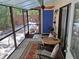 Cozy screened-in porch with a ceiling fan and access to a charming backyard at 2411 Quail Ct, Bradenton, FL 34209