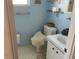 Cozy blue bathroom with hexagon tile and toilet at 2617 Riverbluff Pkwy # V151, Sarasota, FL 34231