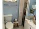 Bathroom featuring a toilet and sink at 2617 Riverbluff Pkwy # V151, Sarasota, FL 34231