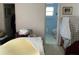 Bedroom area with view to a closet and blue bathroom at 2617 Riverbluff Pkwy # V151, Sarasota, FL 34231