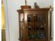A glass display cabinet showcases unique decorations and collectibles at 2617 Riverbluff Pkwy # V151, Sarasota, FL 34231
