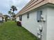 Exterior side view of the home with landscaping and outdoor storage at 2617 Riverbluff Pkwy # V151, Sarasota, FL 34231