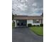 Exterior of the home with a carport, and well manicured landscaping at 2617 Riverbluff Pkwy # V151, Sarasota, FL 34231