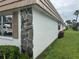 Side exterior view of the property with well maintained landscaping at 2617 Riverbluff Pkwy # V151, Sarasota, FL 34231