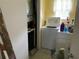 Functional laundry room with washer, dryer, and ample space at 2617 Riverbluff Pkwy # V151, Sarasota, FL 34231
