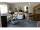 Bright living room with neutral carpeting, comfortable seating, and a doorway leading to other rooms at 2617 Riverbluff Pkwy # V151, Sarasota, FL 34231
