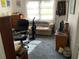 Office featuring a sofa and bright window with curtains at 2617 Riverbluff Pkwy # V151, Sarasota, FL 34231