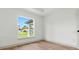 Bright bedroom with wood flooring, large window, closet and fresh paint at 2692 Pretzel Ln, North Port, FL 34286