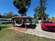 Outdoor patio with pergola, hammock, backyard views and a playset for entertainment at 2804 11Th Street E Ct, Bradenton, FL 34208