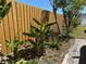 Backyard featuring a wooden fence, growing banana plants and a peaceful outdoor space at 2804 11Th Street E Ct, Bradenton, FL 34208
