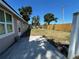 A spacious backyard features a well-maintained lawn, providing ample space for outdoor enjoyment at 2804 11Th Street E Ct, Bradenton, FL 34208