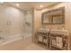 This bathroom offers a shower and tub combo with double sinks and plenty of storage at 3401 54Th W Dr # 201, Bradenton, FL 34210