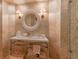 Bright bathroom featuring a tub, glass shower and a circular mirror with a modern sink at 3401 54Th W Dr # 201, Bradenton, FL 34210