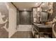 Modern bathroom featuring a bathtub, stylish wallpaper, and sleek fixtures, creating a luxurious space at 3401 54Th W Dr # 201, Bradenton, FL 34210