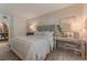 Comfortable main bedroom with decorative headboard, neutral colors, and ample natural light at 3401 54Th W Dr # 201, Bradenton, FL 34210