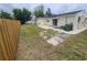 Fenced backyard with a patio and some landscaping potential at 3526 Southern W Pkwy, Bradenton, FL 34205