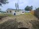 Backyard of the home with a fence, and a view of the home's exterior at 3526 Southern W Pkwy, Bradenton, FL 34205