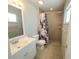 Bathroom featuring a walk-in shower, updated vanity and tile flooring at 3526 Southern W Pkwy, Bradenton, FL 34205