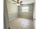Cozy bedroom with tile flooring, ceiling fan, closet and painted in neutral colors at 3526 Southern W Pkwy, Bradenton, FL 34205