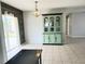 Dining room featuring tile flooring, glass slider, light fixture and hutch at 3526 Southern W Pkwy, Bradenton, FL 34205