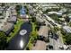 Aerial of Mirror Lake Condominiums showing pond, community pool, and parking areas at 3539 59Th W Ave # 3539, Bradenton, FL 34210