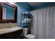 Bathroom featuring decorative vanity, mirror, toilet, and shower with curtain at 3539 59Th W Ave # 3539, Bradenton, FL 34210