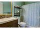Bathroom with a vanity and toilet, along with a shower curtain at 3539 59Th W Ave # 3539, Bradenton, FL 34210