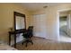 Bedroom featuring bright window, desk, chair and wood-look flooring at 3539 59Th W Ave # 3539, Bradenton, FL 34210