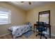 Bedroom featuring bright window, desk, chair and wood-look flooring at 3539 59Th W Ave # 3539, Bradenton, FL 34210
