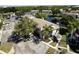 Exterior view of Mirror Lake Condominiums with parking area, landscaping, and pond at 3539 59Th W Ave # 3539, Bradenton, FL 34210