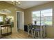 Dining table with seating near to a window and adjacent to the living room at 3539 59Th W Ave # 3539, Bradenton, FL 34210