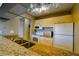 Well-designed kitchen with granite countertop bar, a modern appliance package, and ample cabinet space at 3539 59Th W Ave # 3539, Bradenton, FL 34210