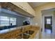 Modern kitchen featuring a breakfast bar and view into the living room at 3539 59Th W Ave # 3539, Bradenton, FL 34210
