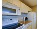 White kitchen featuring modern appliances and granite countertops at 3539 59Th W Ave # 3539, Bradenton, FL 34210
