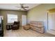 Spacious living room with wood floors, ceiling fan, and natural light from the window at 3539 59Th W Ave # 3539, Bradenton, FL 34210