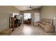 Cozy living room featuring a sofa, armchair, and vaulted ceilings at 3539 59Th W Ave # 3539, Bradenton, FL 34210