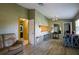Open-concept living area with wood floors, adjacent to kitchen, and comfortable seating at 3539 59Th W Ave # 3539, Bradenton, FL 34210