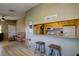 Inviting living space with bar access, wood flooring, and comfortable seating area at 3539 59Th W Ave # 3539, Bradenton, FL 34210