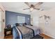 Well-lit bedroom features hardwood floors and a large window allowing for plenty of natural light at 401 N Jefferson Ave, Sarasota, FL 34237