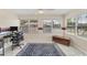 Versatile bonus room with large windows, neutral walls, and a unique blue and red accent band at 401 N Jefferson Ave, Sarasota, FL 34237