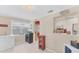 A charming dining area featuring ample lighting and adjacent to the kitchen and a cold storage area at 401 N Jefferson Ave, Sarasota, FL 34237