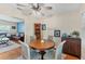 Bright dining room featuring a round table, hardwood floors, and an open view into the living room at 401 N Jefferson Ave, Sarasota, FL 34237