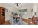 Cozy dining area with a round table, four chairs, and natural light from a large window at 401 N Jefferson Ave, Sarasota, FL 34237