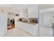 Spacious kitchen with ample white cabinetry, granite countertops, and views to other rooms at 401 N Jefferson Ave, Sarasota, FL 34237