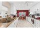 Bright kitchen featuring granite countertops, stainless sink, and an adjacent breakfast nook with counter seating at 401 N Jefferson Ave, Sarasota, FL 34237