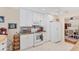 Well-lit kitchen features all white appliances, countertops, cabinetry, and an adjacent dining area at 401 N Jefferson Ave, Sarasota, FL 34237