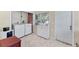 A tidy laundry area equipped with a front-load washer and dryer, plus ample cabinet storage at 401 N Jefferson Ave, Sarasota, FL 34237