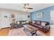 Cozy living room featuring hardwood floors, a ceiling fan, and comfortable seating arrangement at 401 N Jefferson Ave, Sarasota, FL 34237